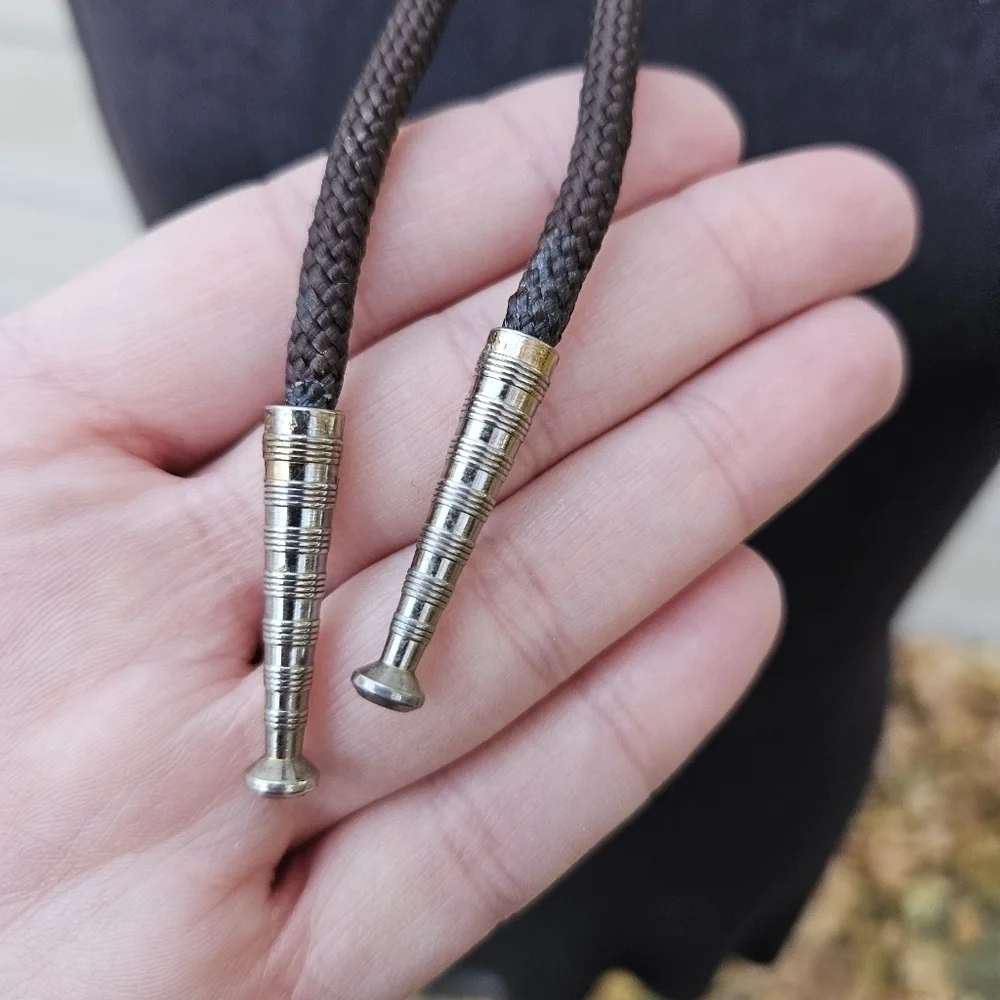 gold leaf and goldstone bolo tie on brown cord